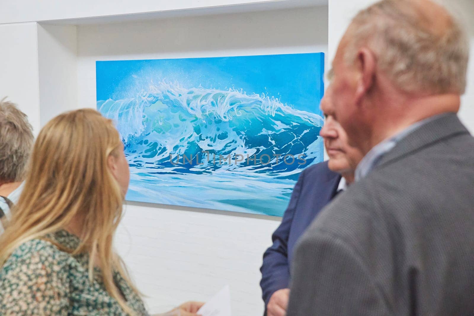Skagen, Denmark, May, 2023: Visitors look at the paintings in the gallery