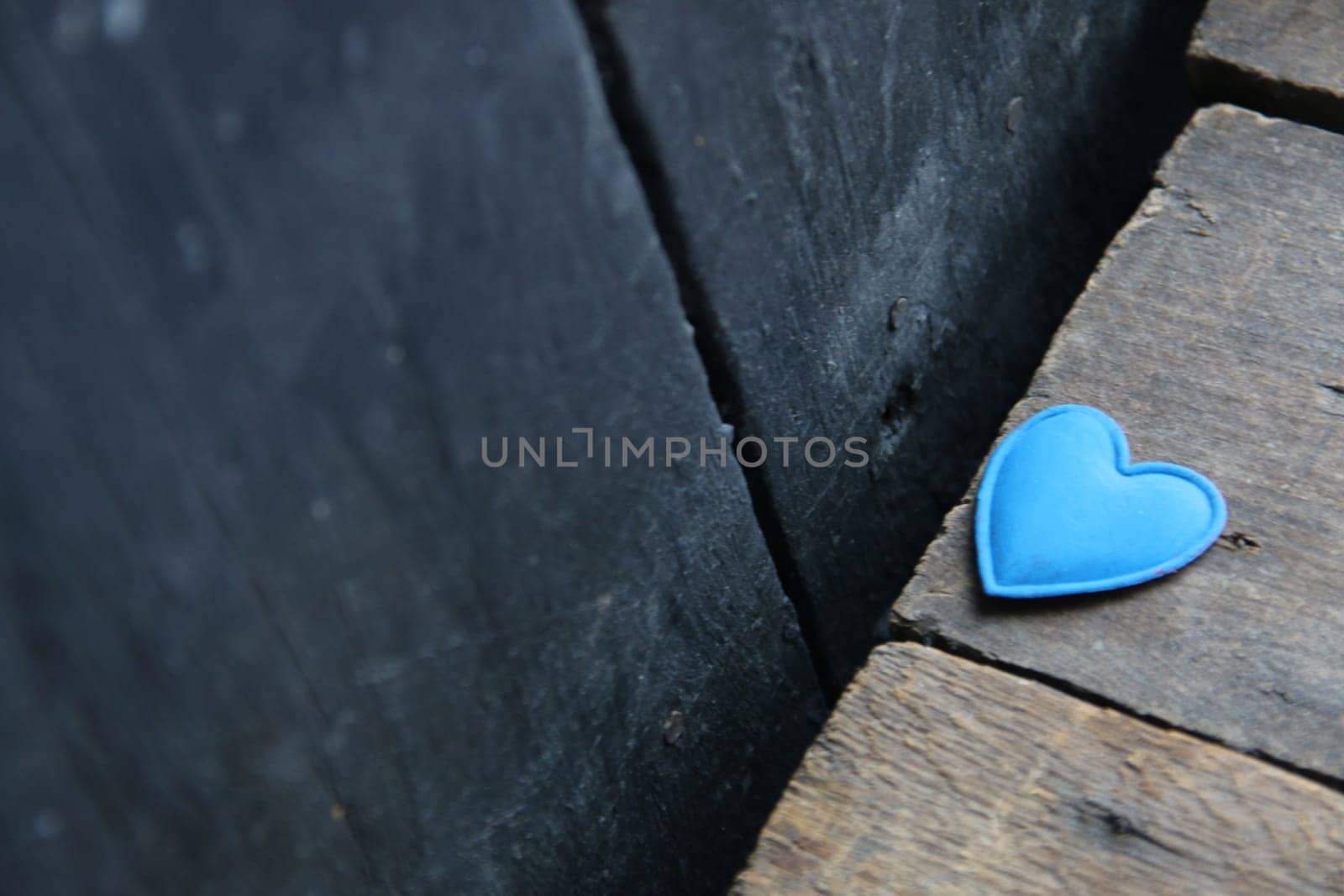 Valentines Day Concept. Blue heart on wooden background. by Markgraf