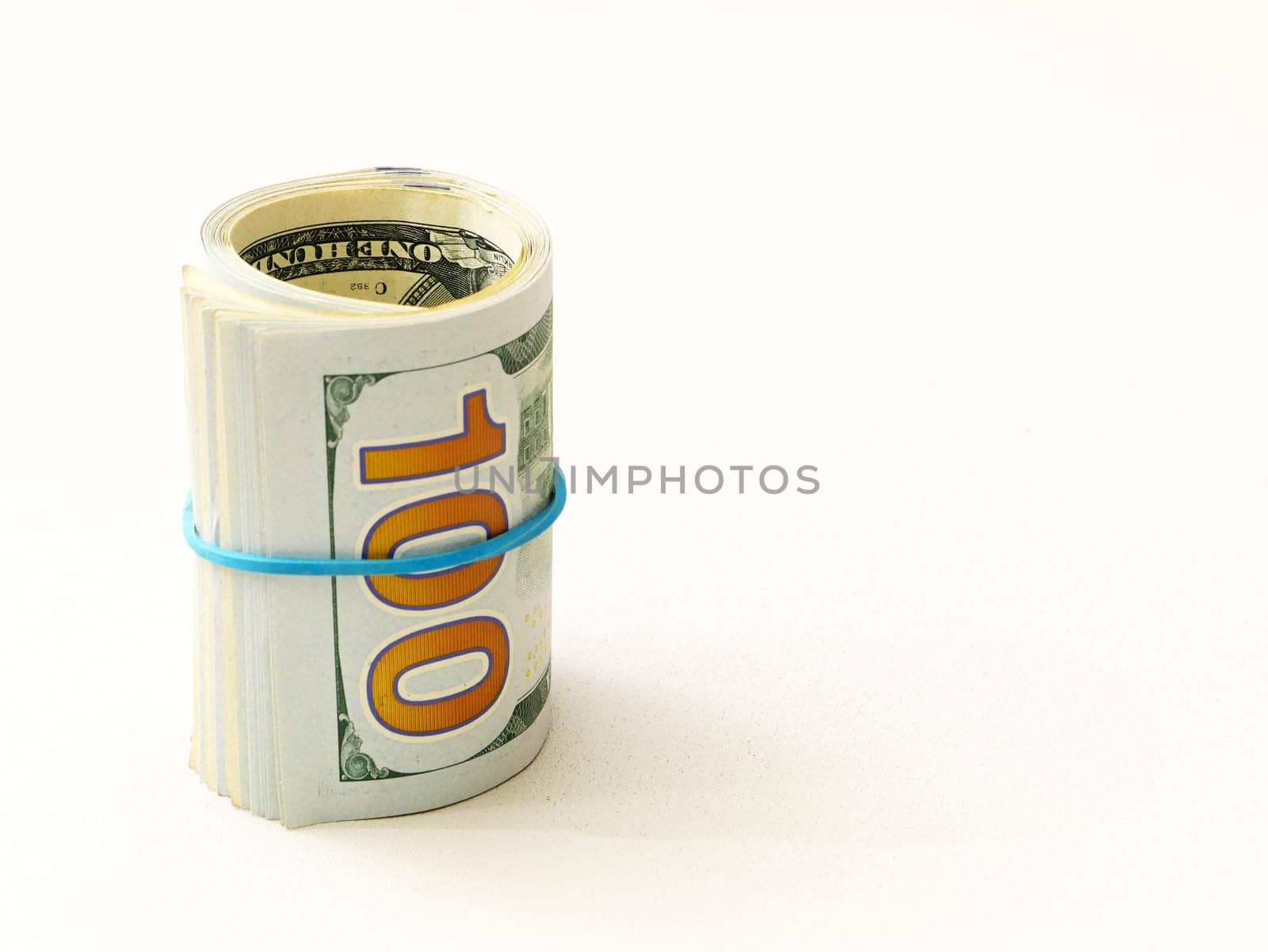 Rolled up dollar bills on a white background. by gelog67