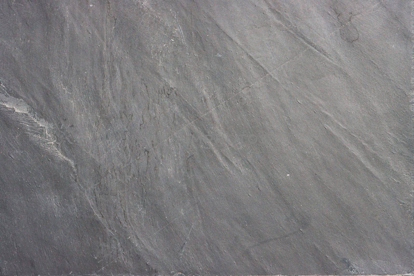 The texture of the stone in gray close-up.