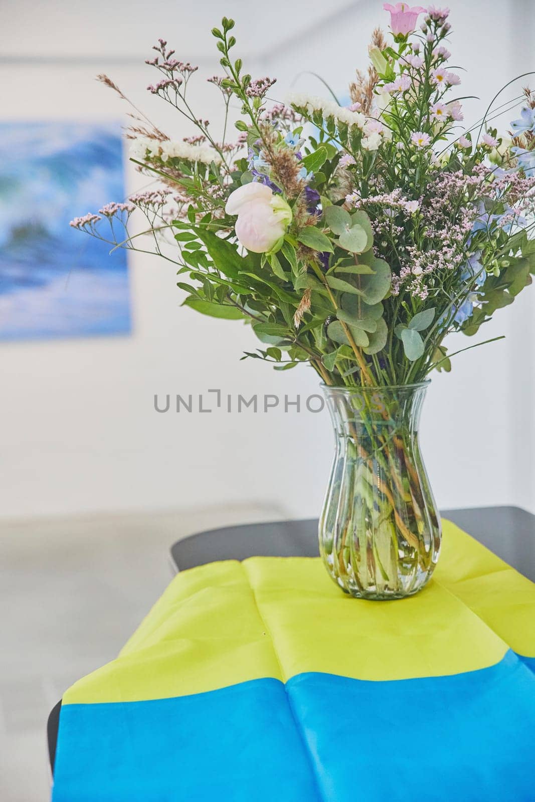 Wildflowers in a vase and Ukrainian flag.