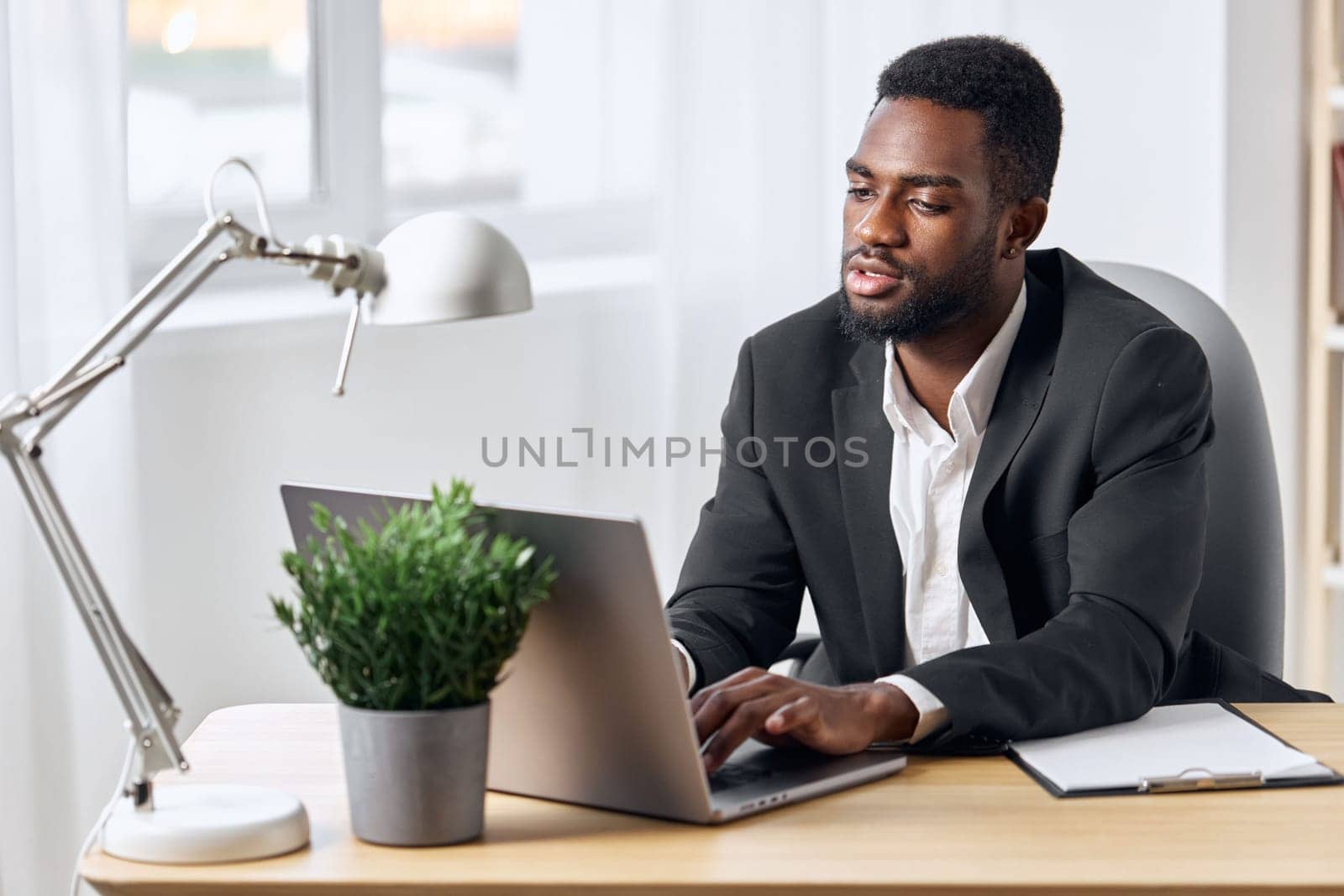job man computer office online laptop modern space american desk cyberspace workplace call looking person manager worker black freelancer african education student copy