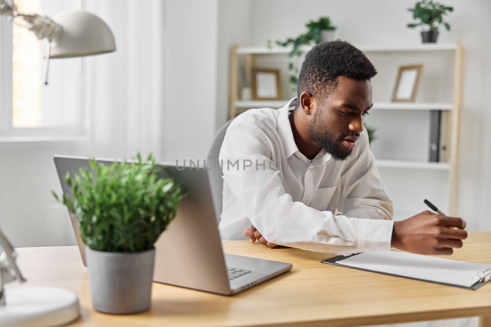 man student american computer job laptop office online education freelancer web african by SHOTPRIME
