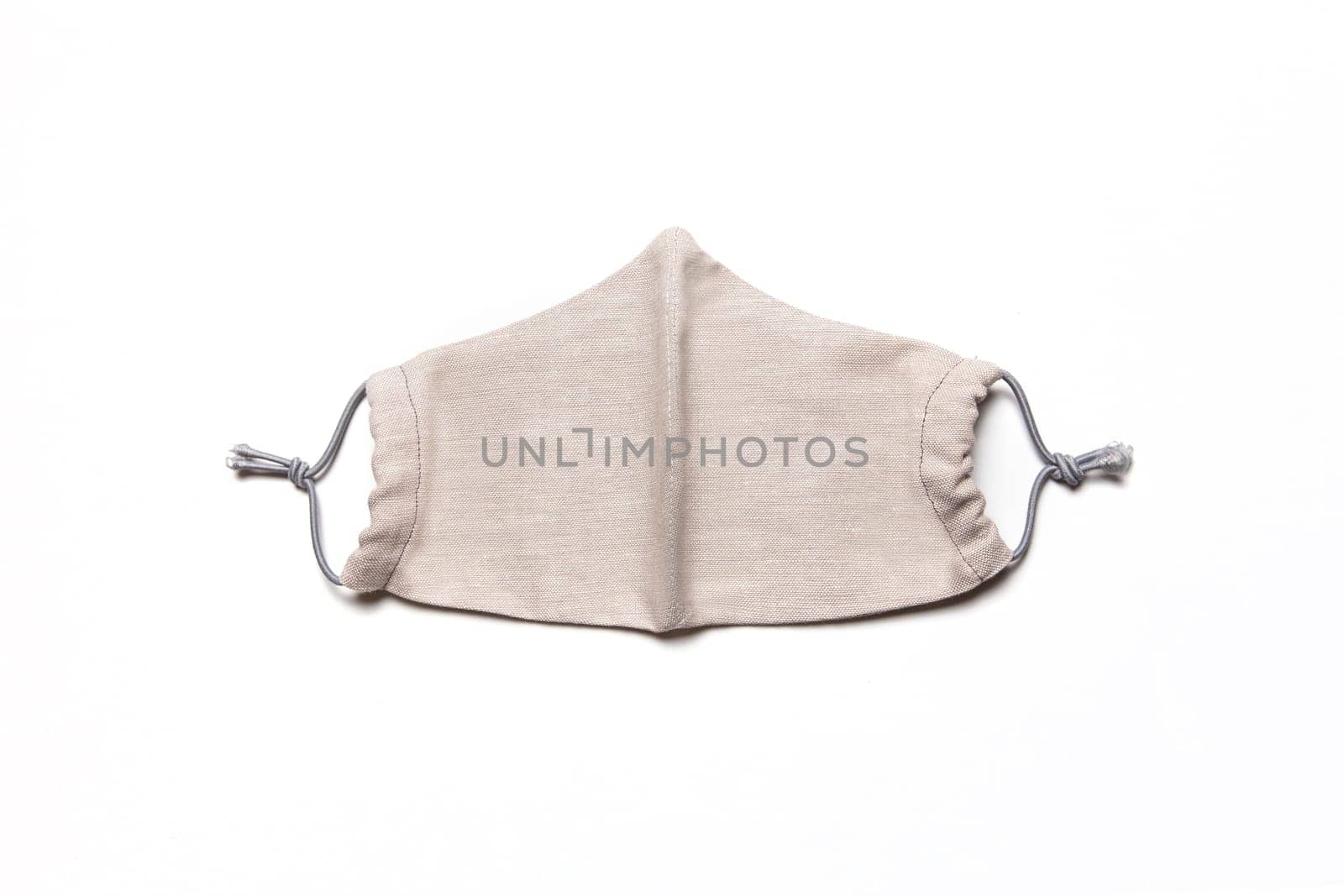 Fabric face mask isolated on a white background. Respiratory protection from coronavirus infection. Personal protective equipment.