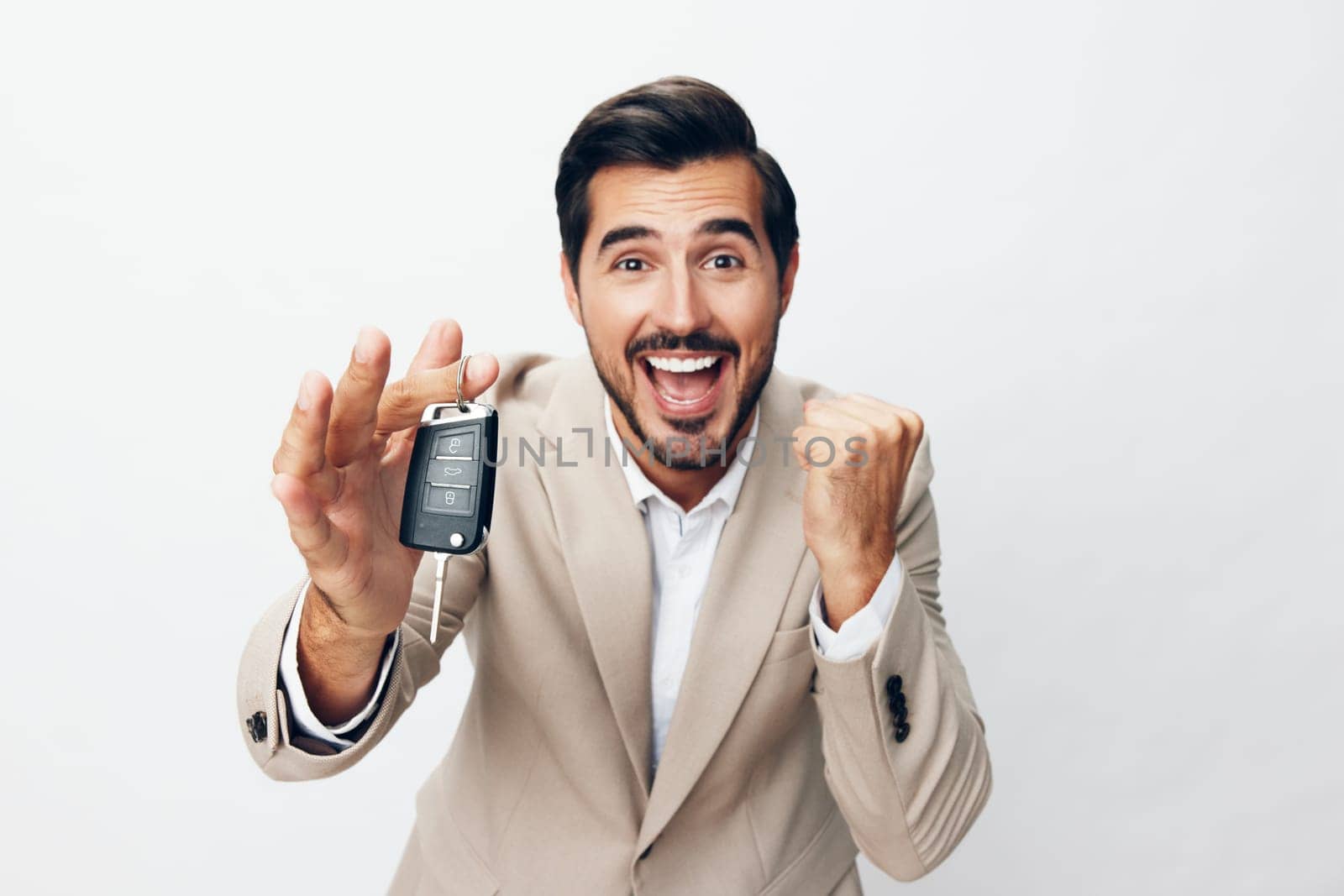 man smile hand holding key car auto service studio buy business by SHOTPRIME