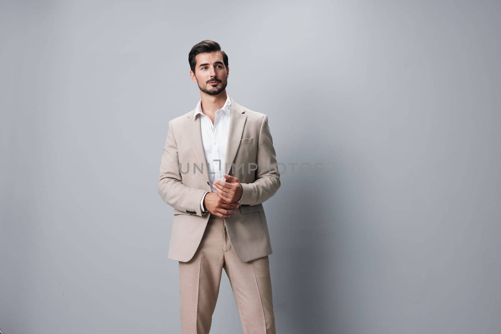 man copyspace young businessman formal professional portrait happy fashion job handsome person studio shirt isolated beige white smiling guy business suit