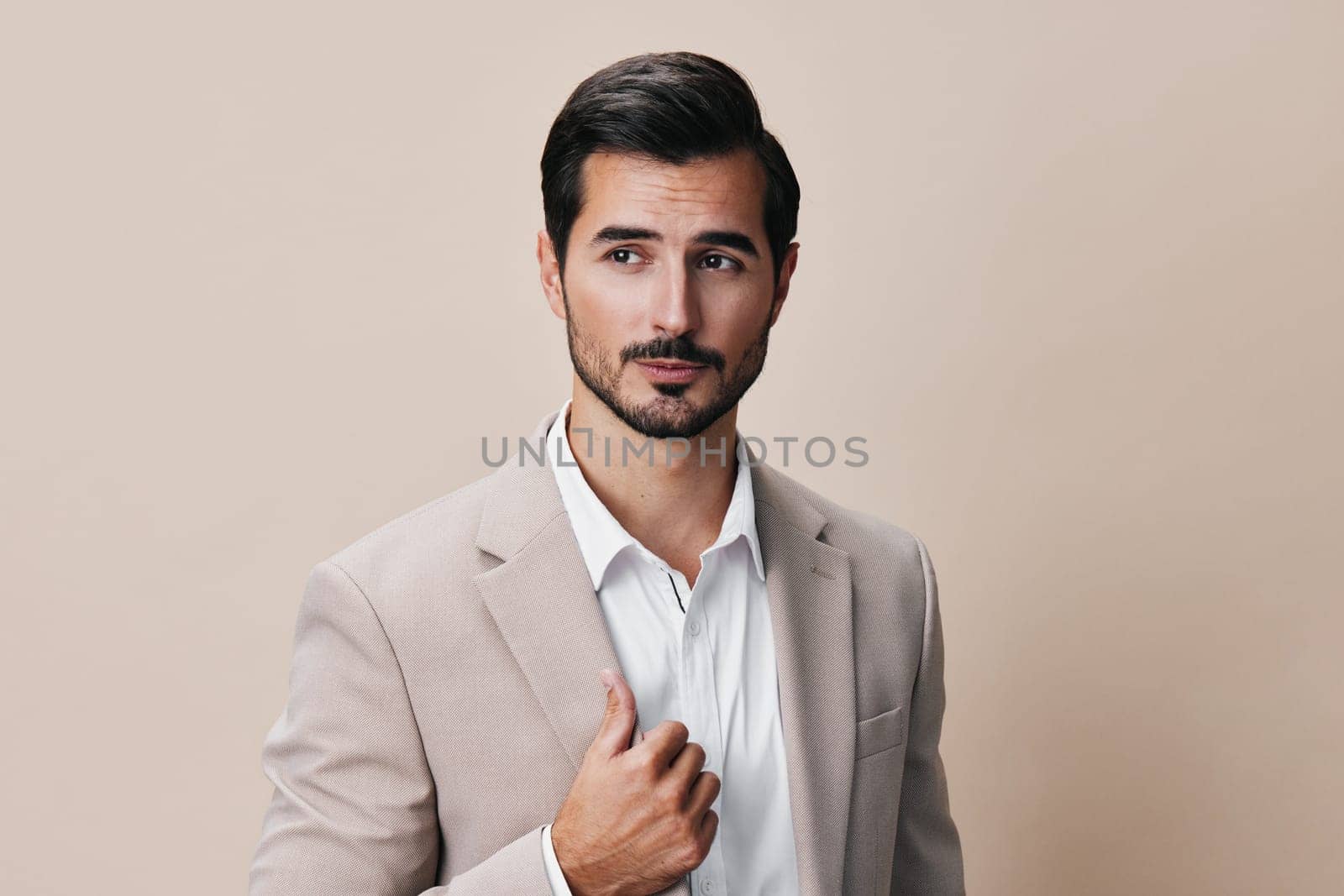 job man portrait posing happy business copyspace smiling suit arm isolated guy attractive white handsome businessman model beige beard office executive