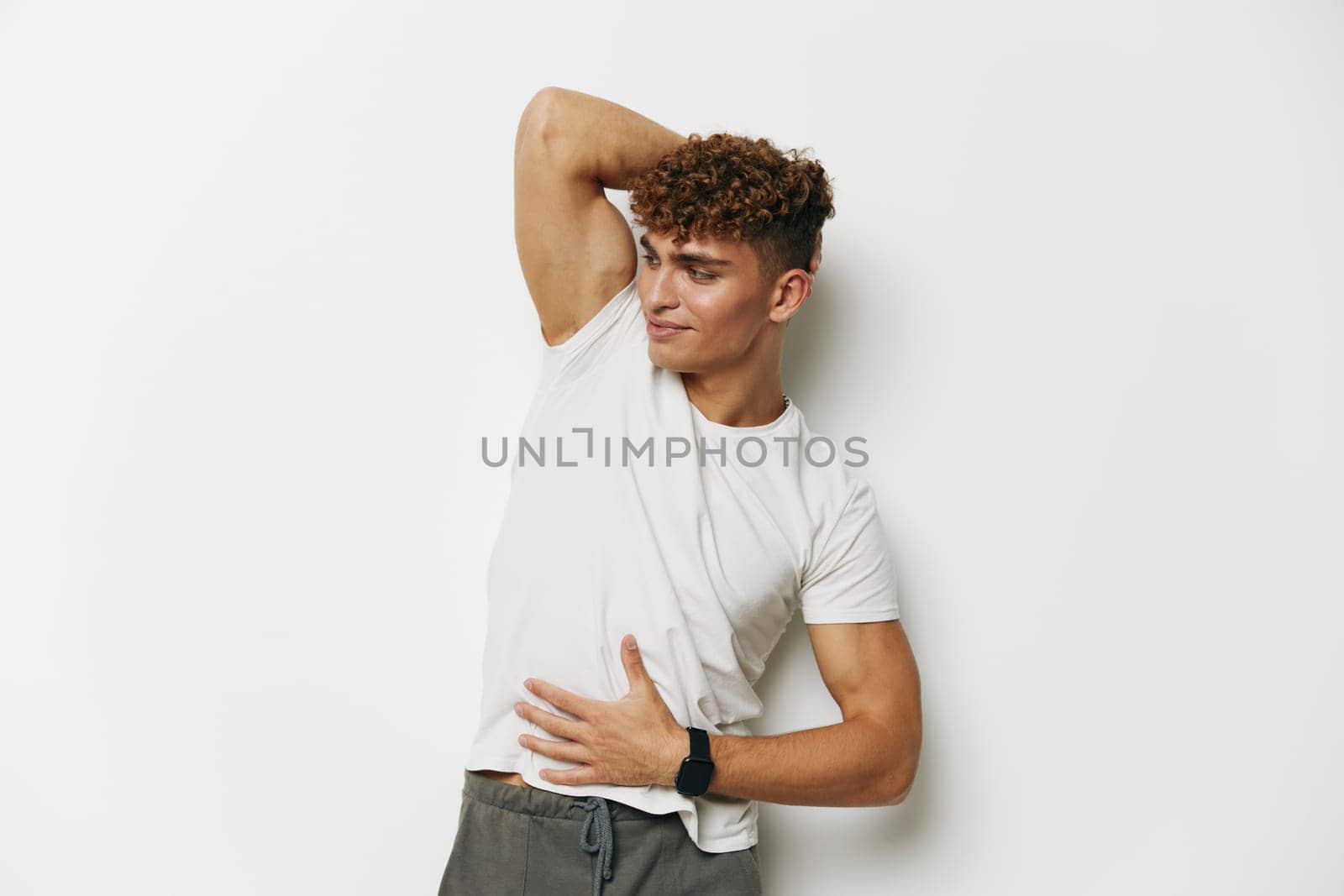man handsome attractive white bicep sport chest white background background standing smile adult muscular by SHOTPRIME