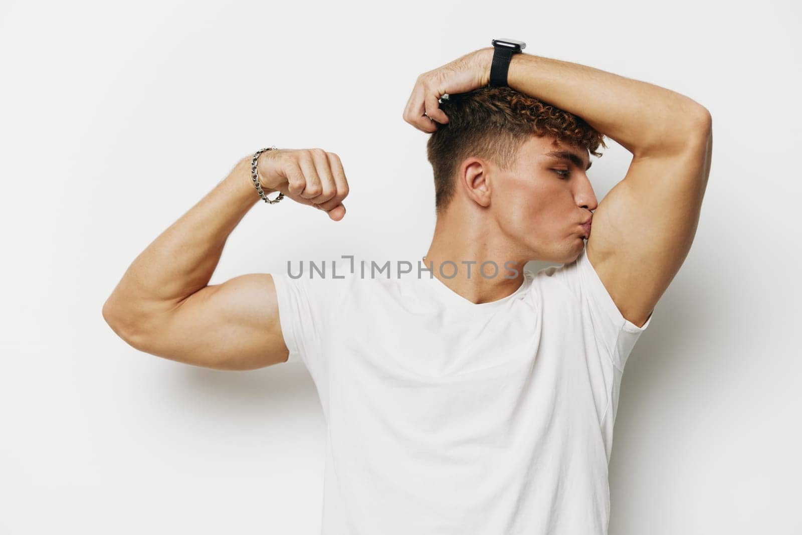 man abs jeans chest standing guy torso gray studio white smile young shirtless gray background strong curly handsome wrist watch sport white background body