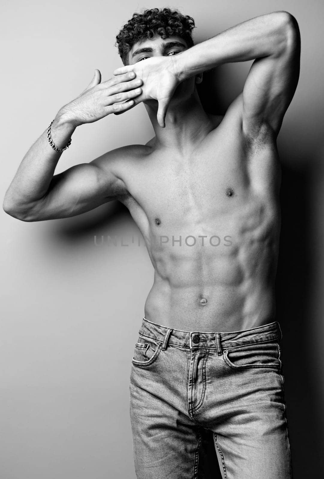 man jeans muscle fashion black male torso muscular adult studio by SHOTPRIME