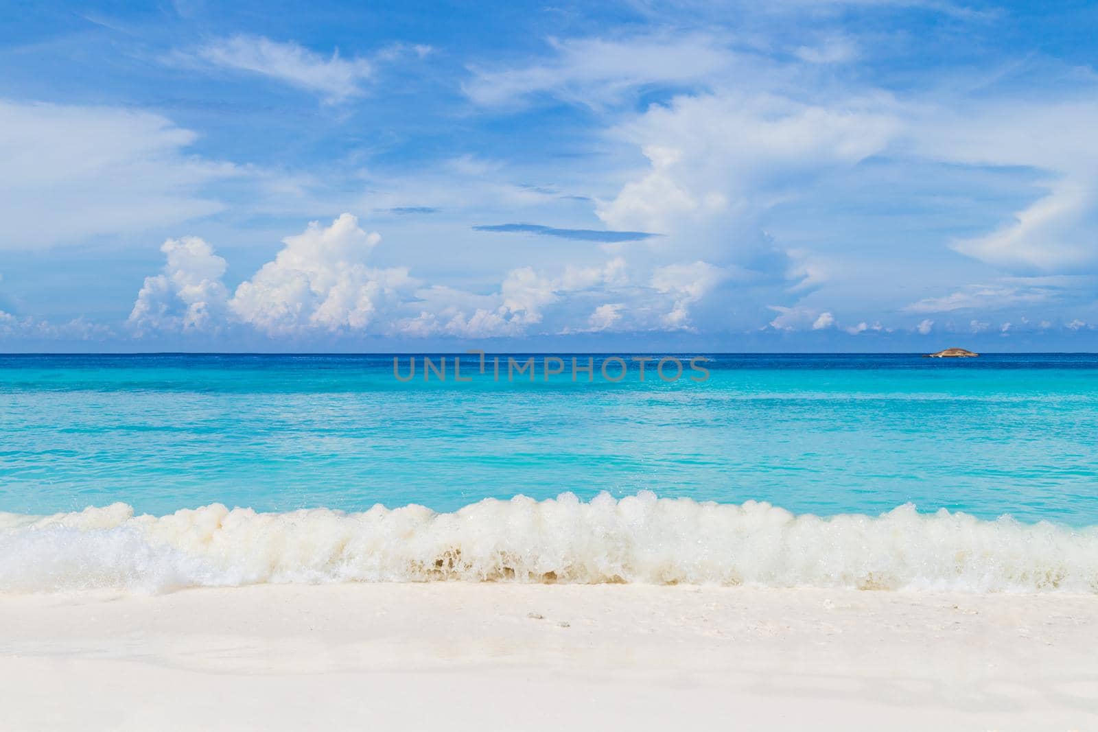 Beautiful sandy beach with wave at Similan Islands, Beautiful tropical island Thailand.