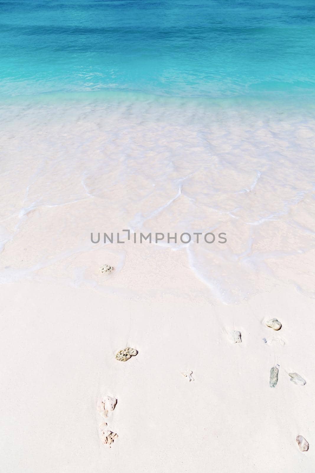 Wave of the sea on the sand beach at Similan islands, Thailand. by Gamjai