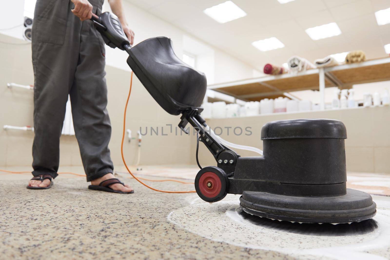 Carpet chemical cleaning with professionally disk machine. Early spring cleaning or regular clean up. High quality photo