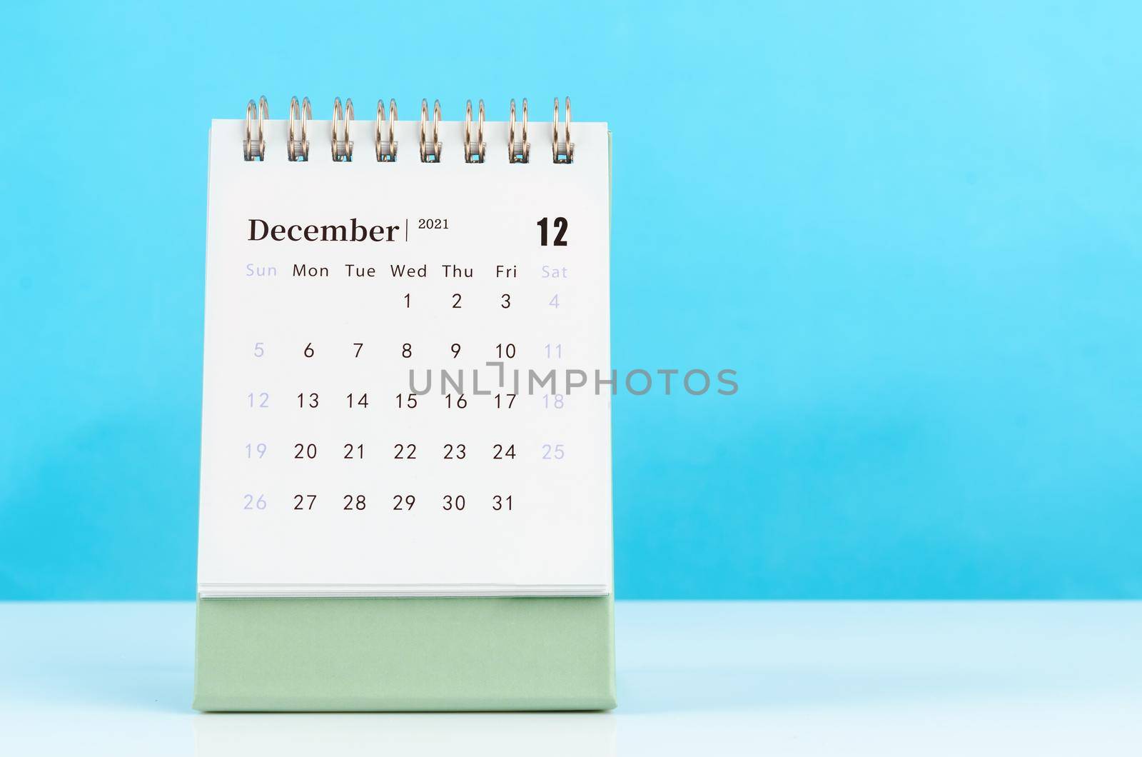 December Calendar 2021 on blue background.