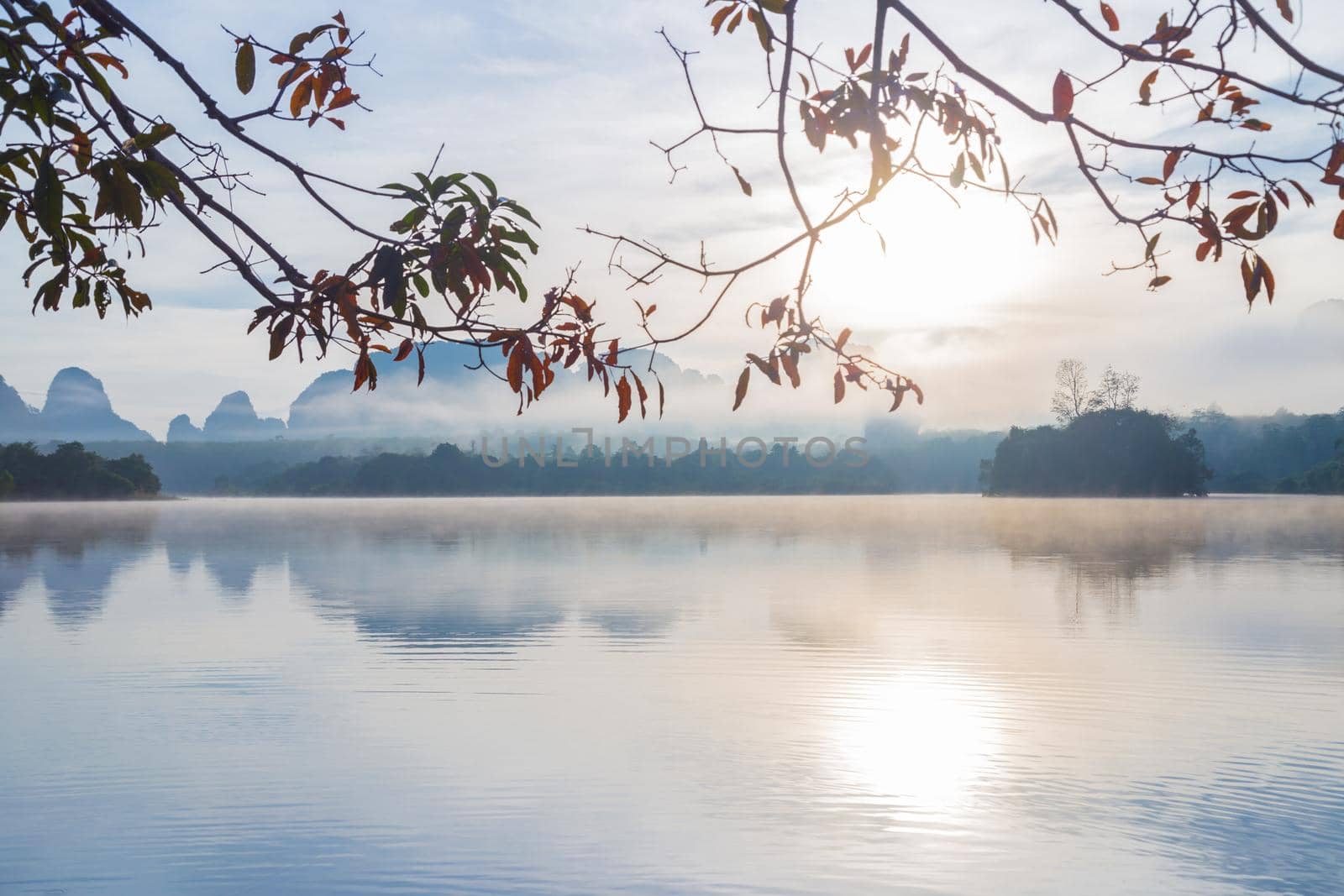 Ban Nong Thale the natural scenery of the sunshine in the morning (mountains, lakes, trees, fog) at Krabi, Thailand.