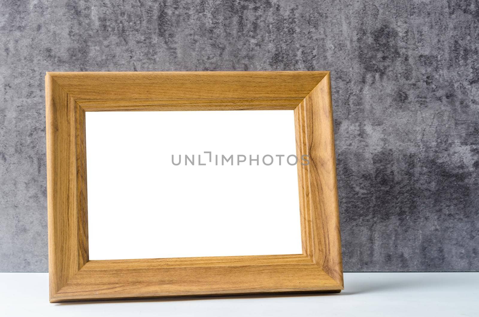 Empty wooden frame on dark background, Save clipping path.