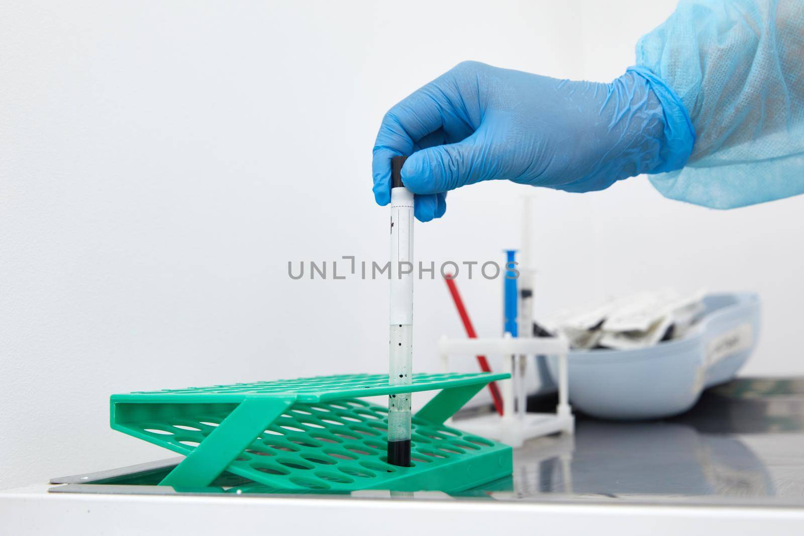 Scientist working with blood sample in laboratory. High quality photo