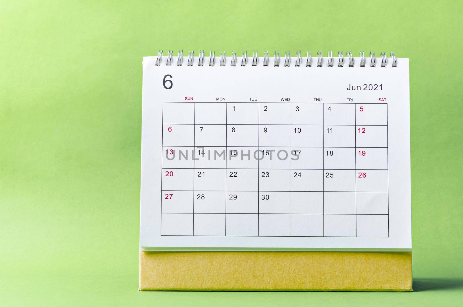 June Calendar 2021 on green background.