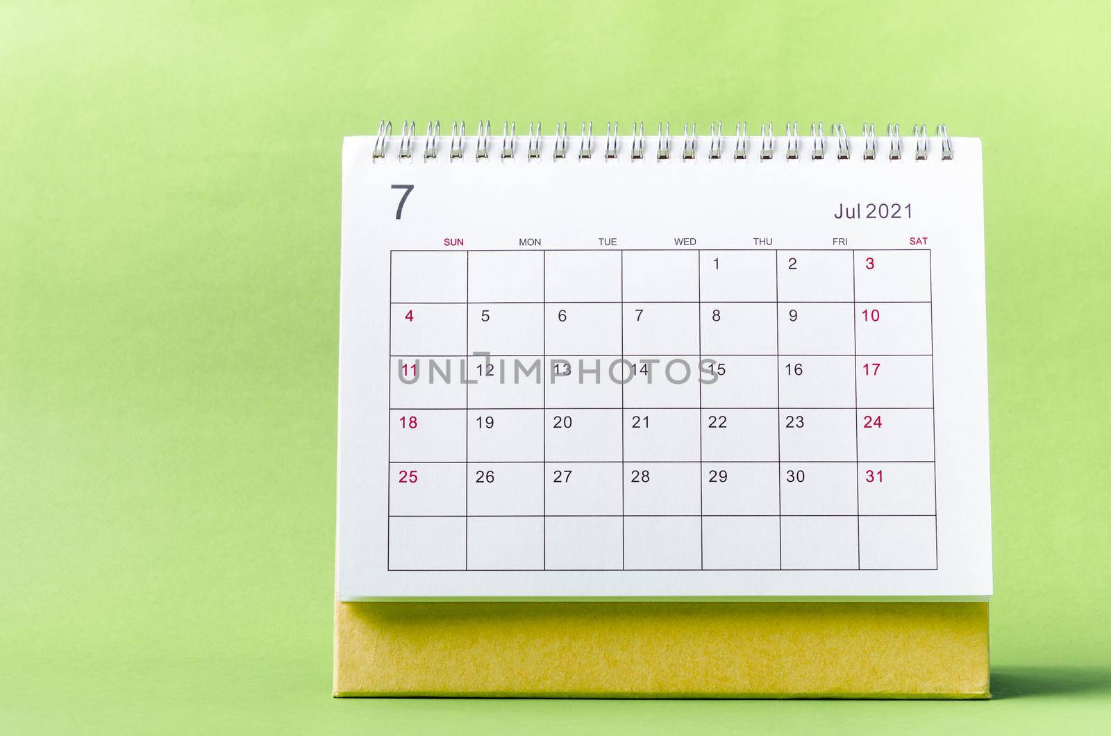 July Calendar 2021 on green background.
