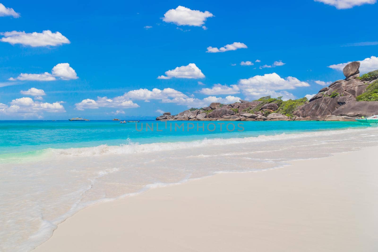 Beautiful sandy beach with wave crashing on sandy shore at Similan Islands Beautiful tropical sea Similan island No.4 at Similan national park, Phang nga Thailand