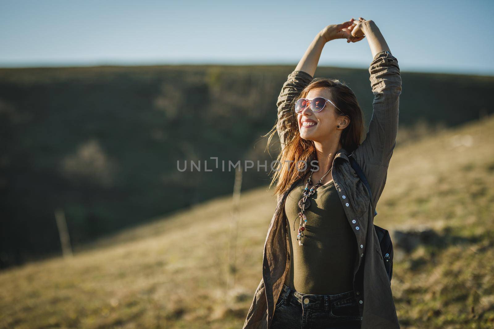 Shot of a happy young woman enjoying the outdoors.