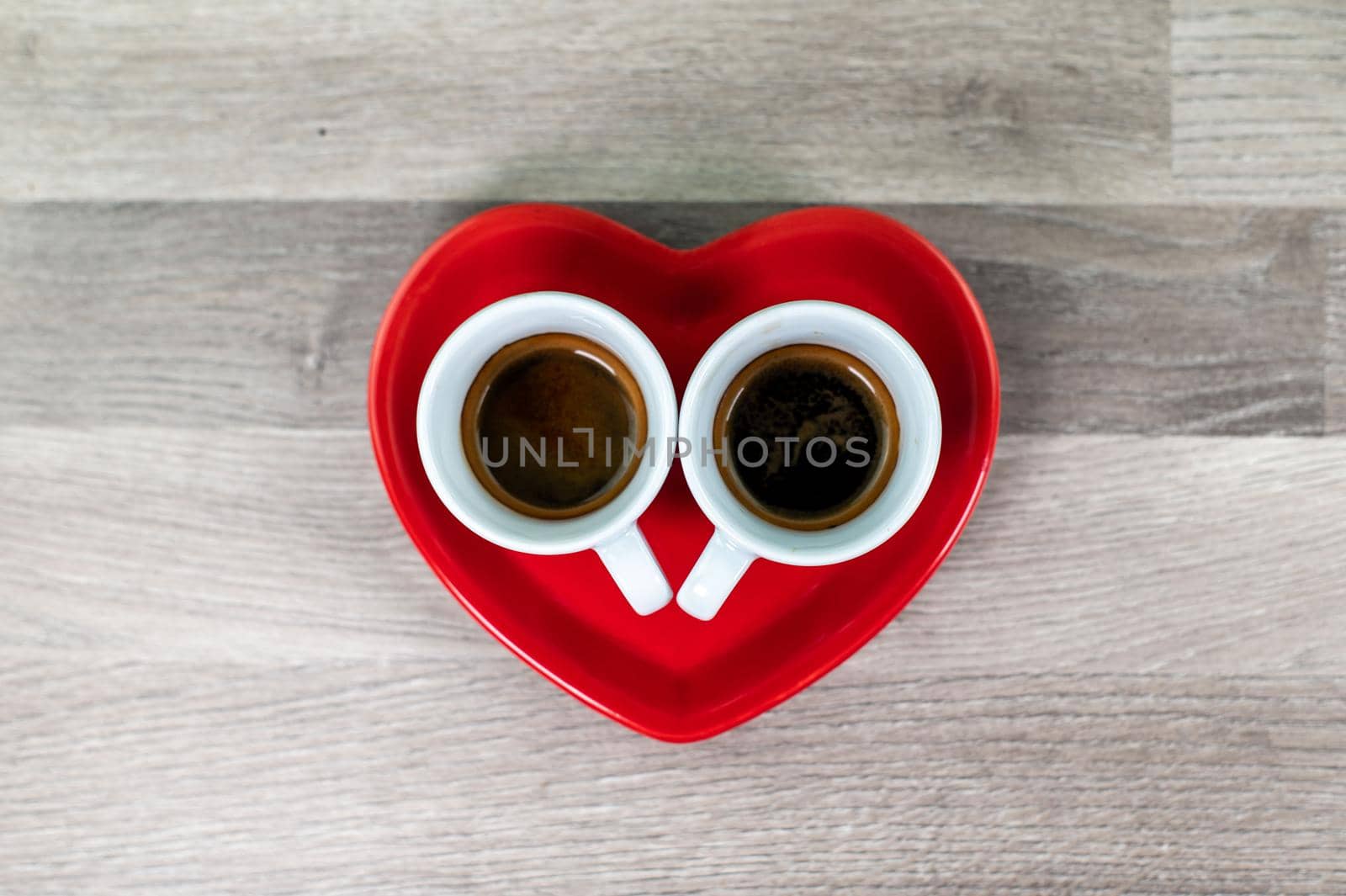 Valentine's Day heart saucer with cup of coffee by carfedeph