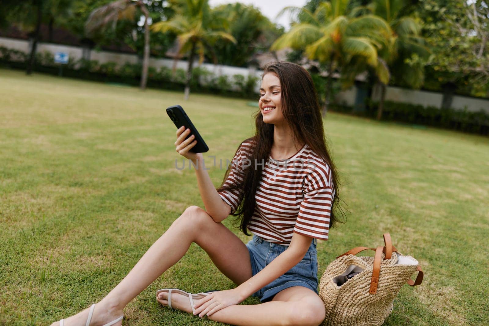 woman phone palm tree blogger grass nature lifestyle human smiling park happy by SHOTPRIME