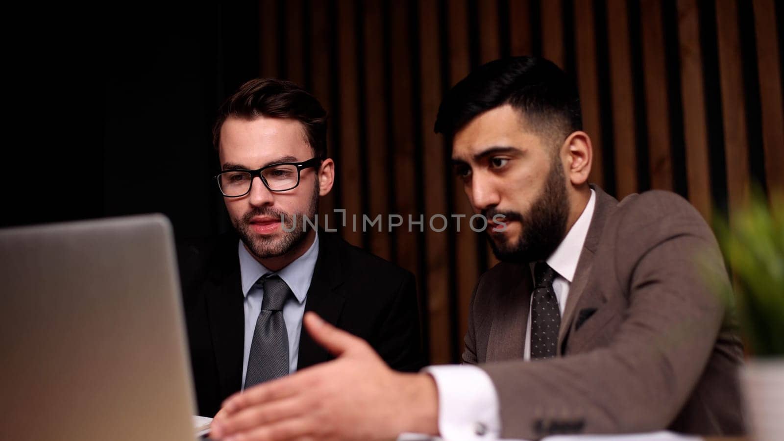 Young business male meeting with a colleague in office at work