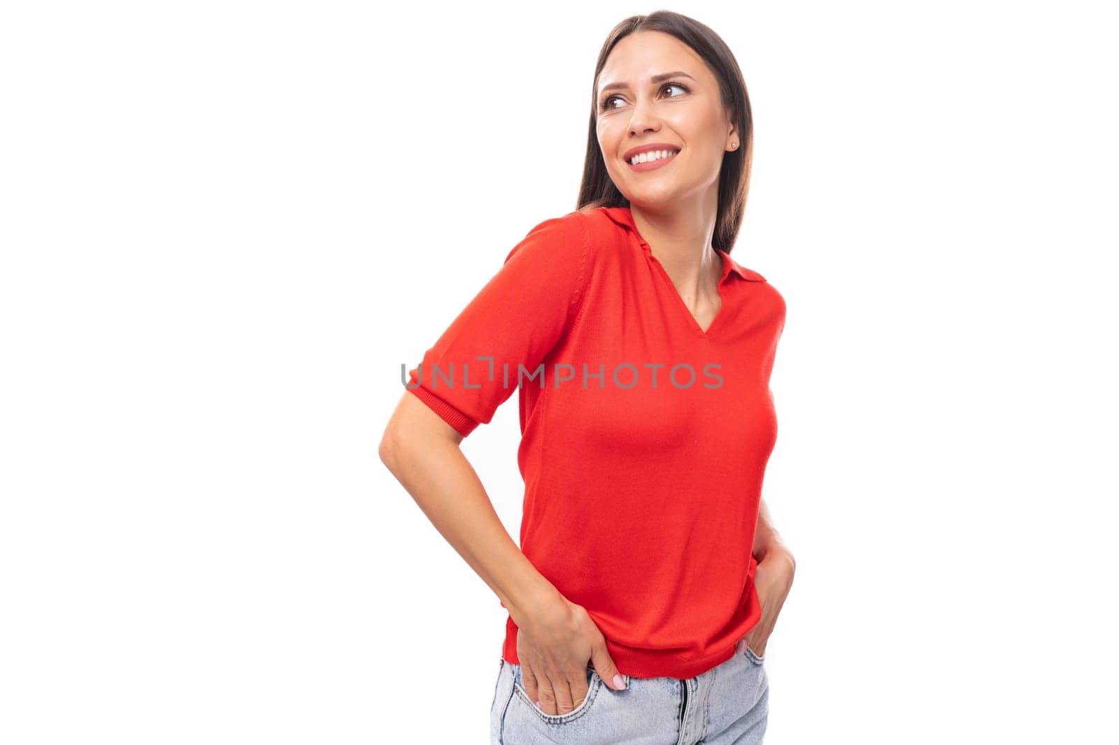 portrait of smiling pretty brunette woman with straight hair in red t-shirt and jeans isolated studio background with copy space.