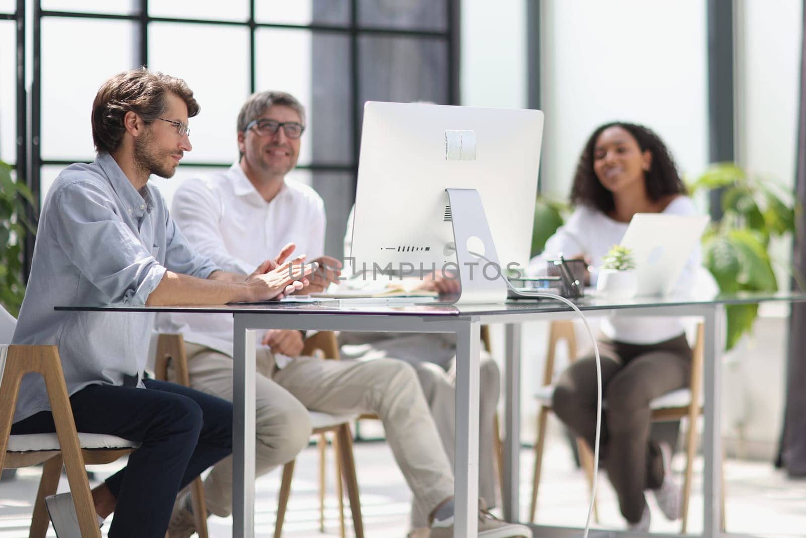 Conversation between managers and employees in the office