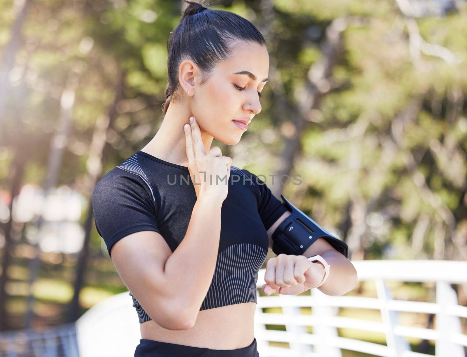 Woman runner, watch and neck for pulse in park, bridge or outdoor for fitness, health or training for sport. Girl, heart rate and check clock for running, performance or wellness in summer sunshine.