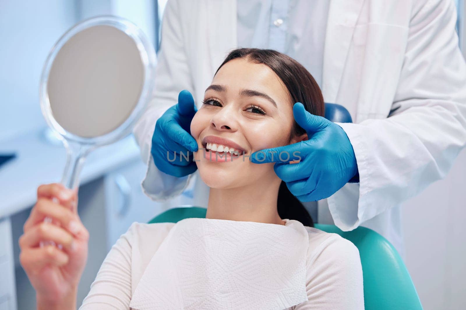 Dentist, mirror and portrait of woman with smile after teeth whitening, service and dental care. Healthcare, dentistry and female patient with orthodontist for oral hygiene, wellness and cleaning.