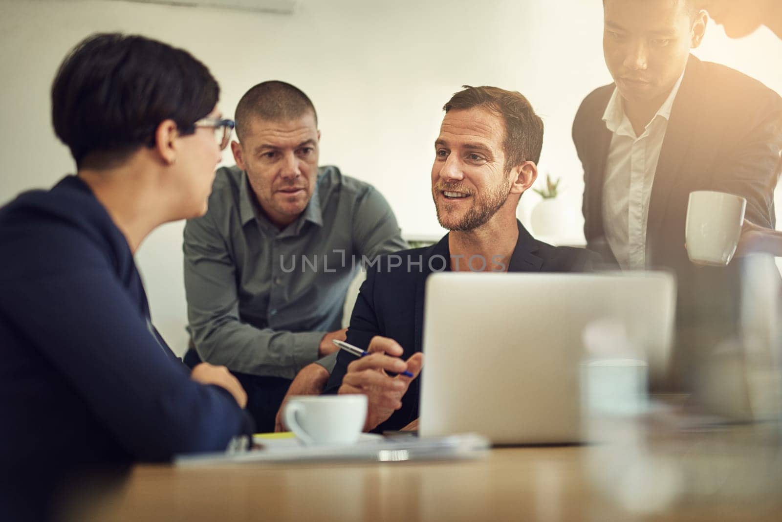 Business meeting, laptop and happy people, manager or group discussion, feedback and office teamwork or planning. Professional man, woman or employees talking of ideas, advice for website on computer.