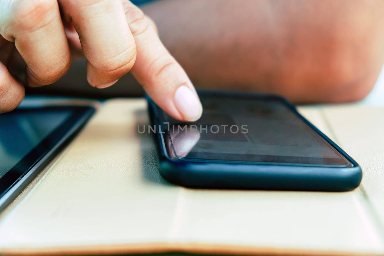 Closeup Image of Teenage guy text messaging on his phone by ponsulak