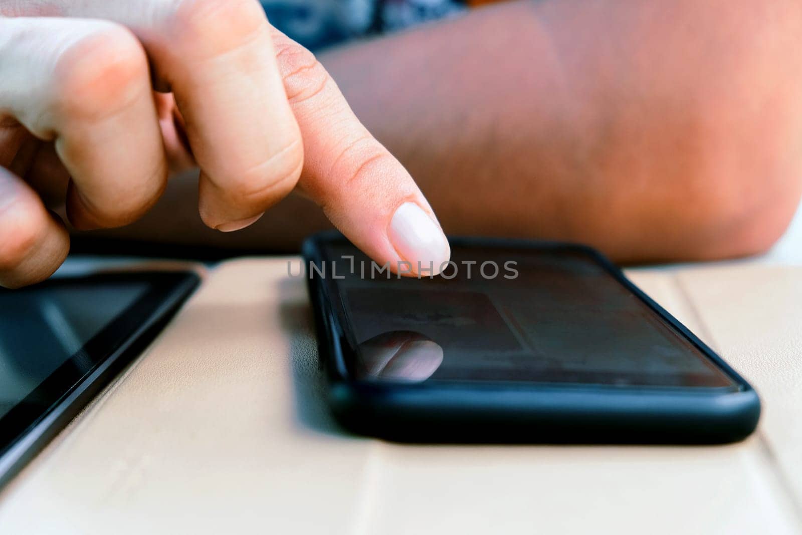 Closeup Image of Teenage guy text messaging on his phone