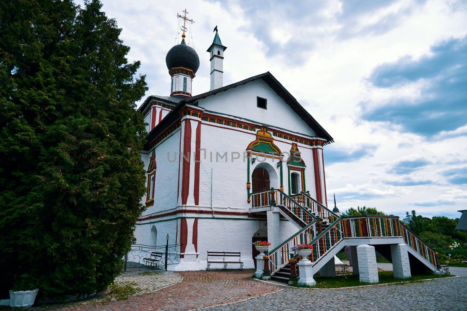 Kolomna, Russia - May 30, 2023: Beautiful white church with a staircase entrance on a spring day