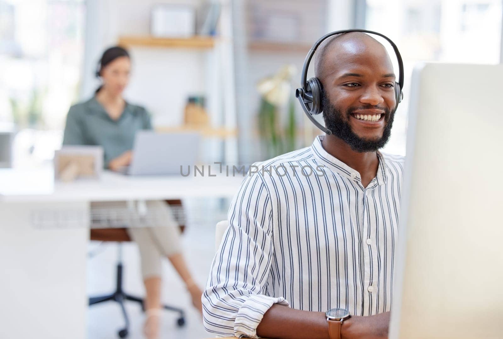 Call center, computer and happy man, virtual consultant or advisor in customer support, online advice and office. contact, communication and business agent or african person on desktop in workspace by YuriArcurs