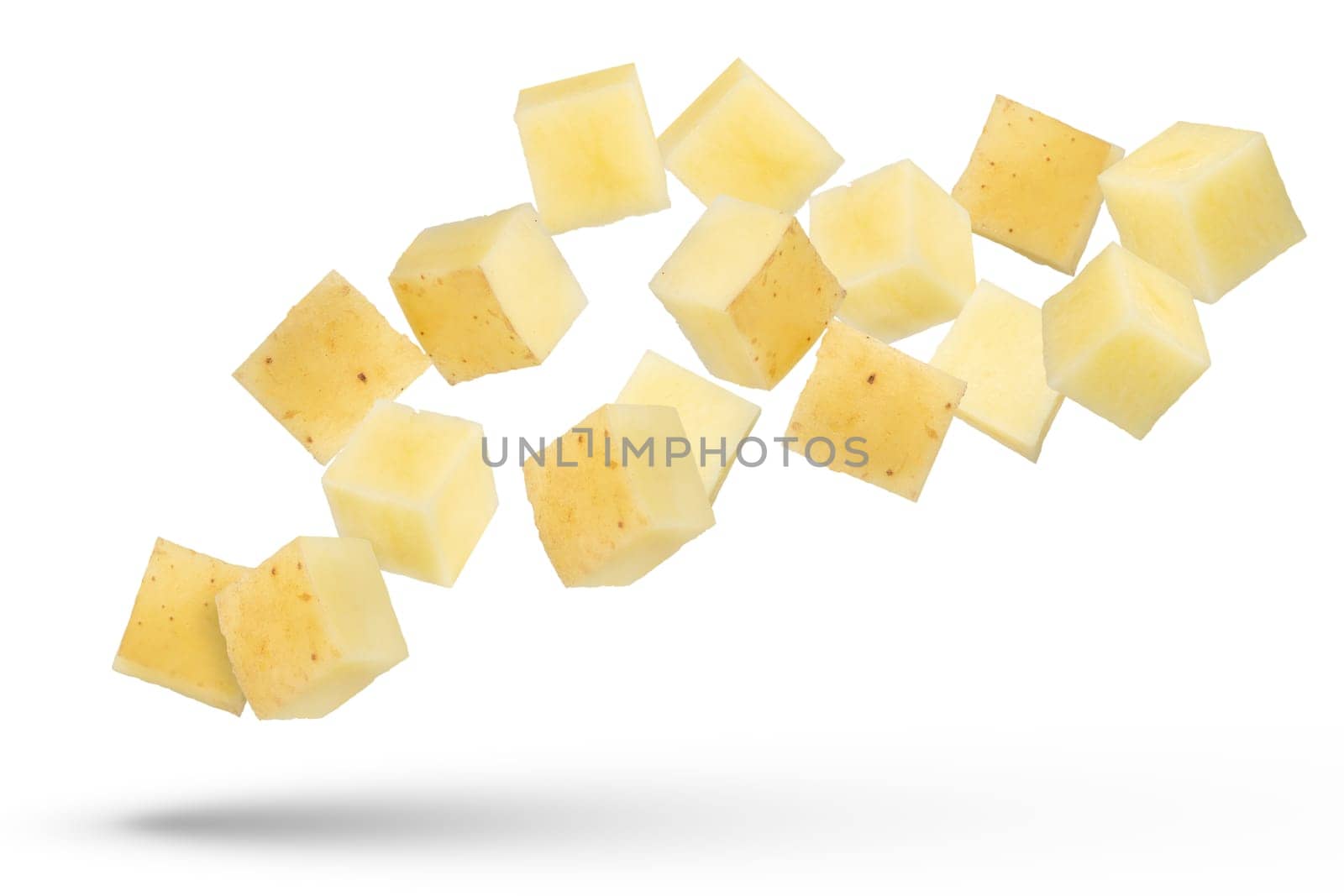 Flying vegetables. Flying potato cubes isolated on white background. Diced fresh potato isolate. by SERSOL