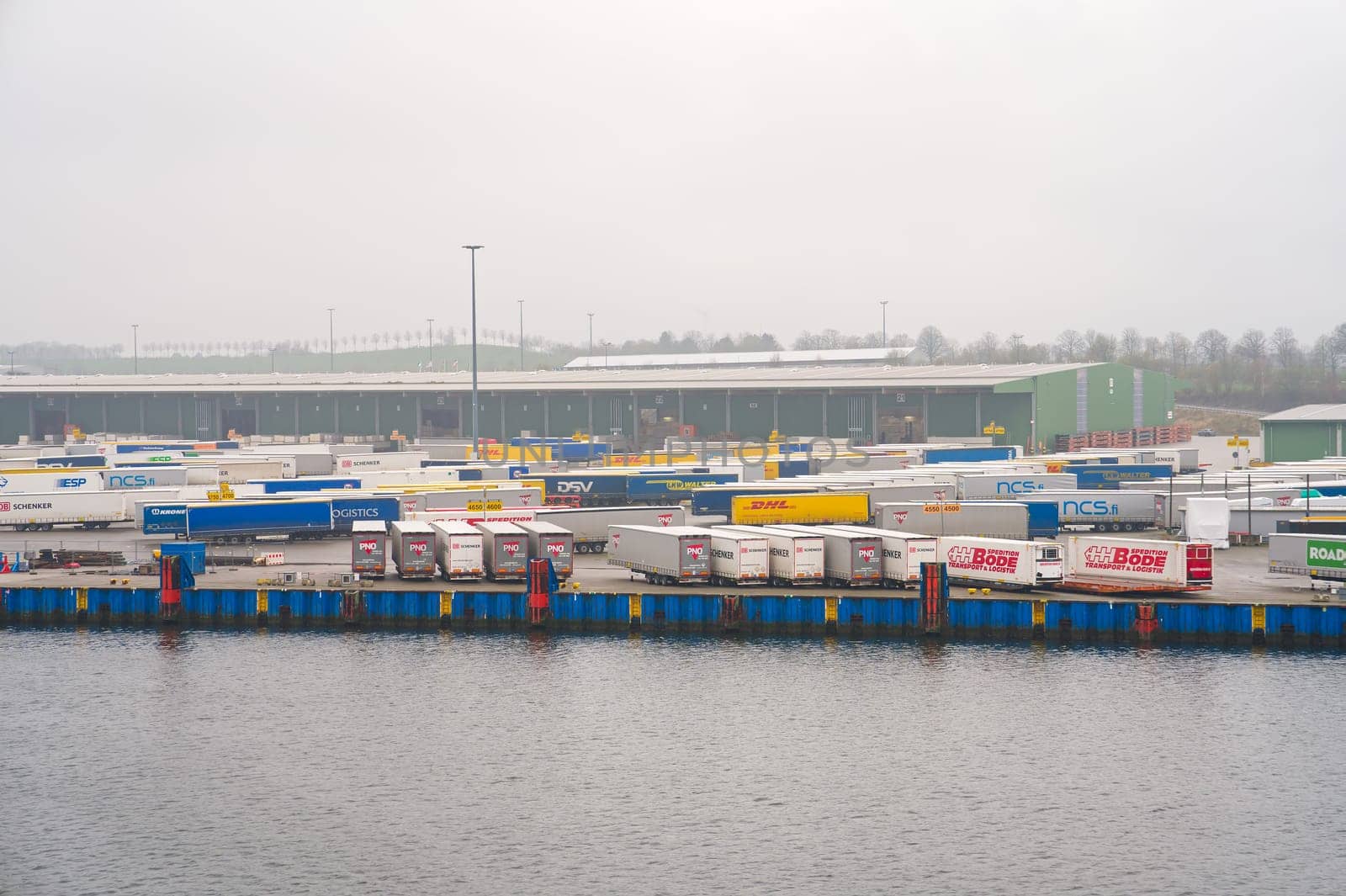 Travemunde, Germany - April 2023. Cargo Sea port Logistics and transportation of Container and cargo car trailers by PhotoTime