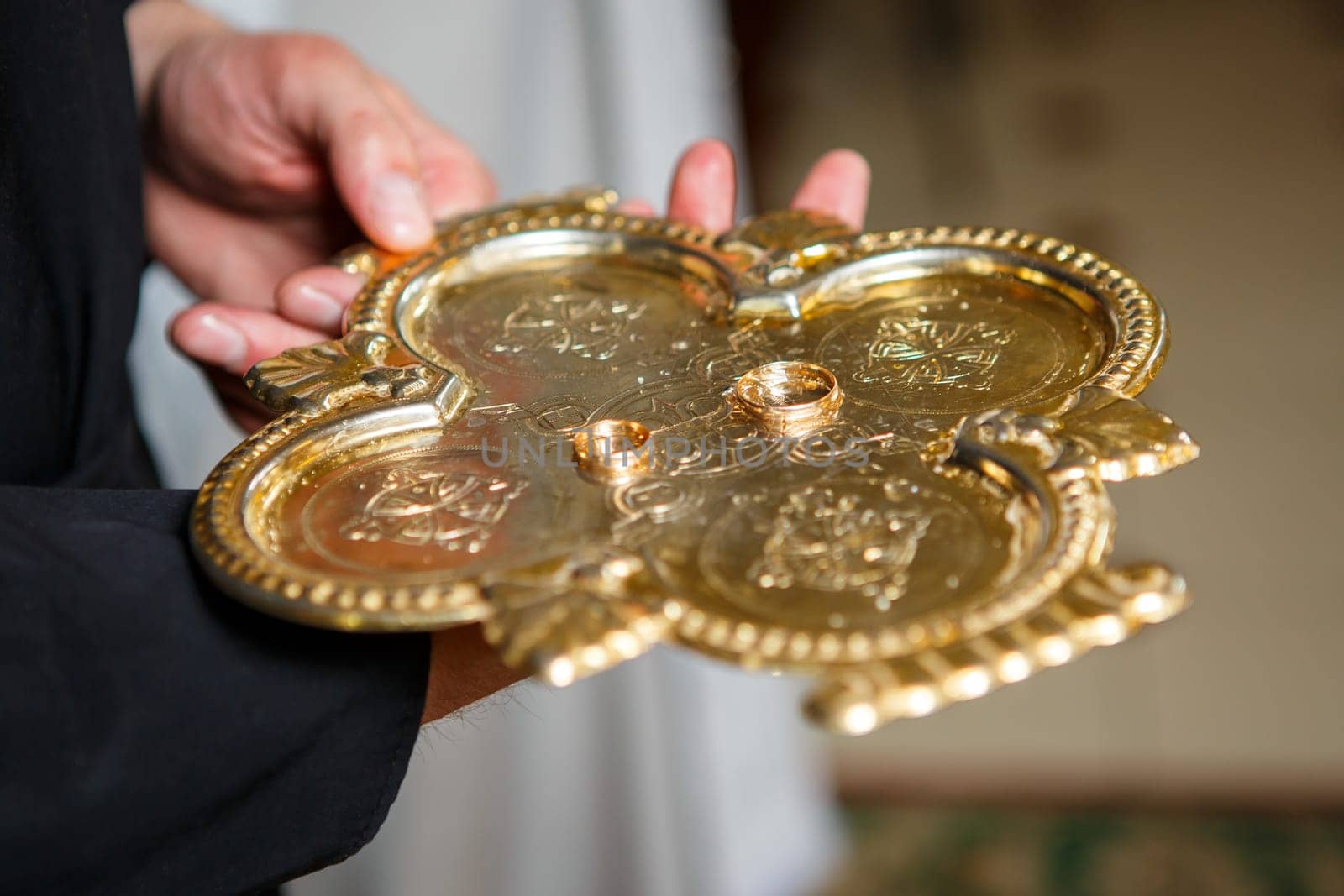 Golden wedding rings for newlyweds on their wedding day