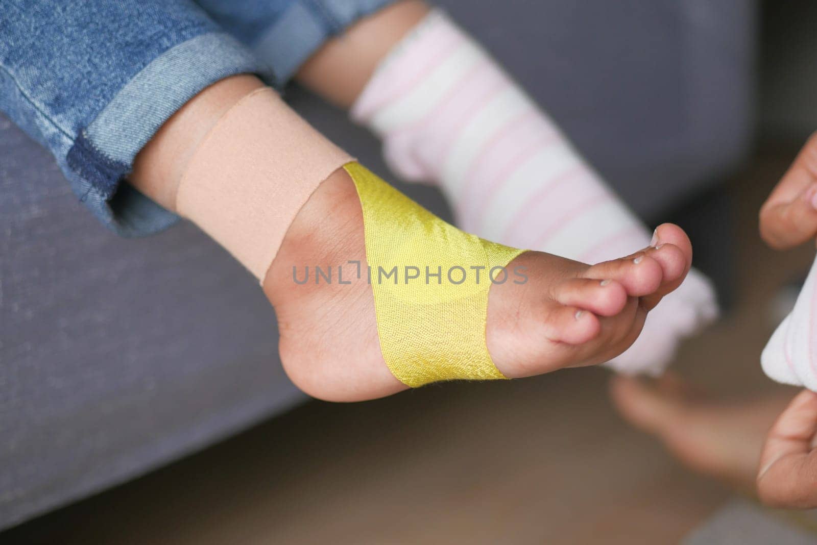 little child boy with plaster bandage on leg