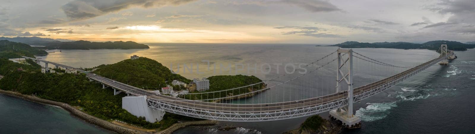 Panoramic aerial view of Onaruto Bridge and whirlpools at sunset. High quality photo