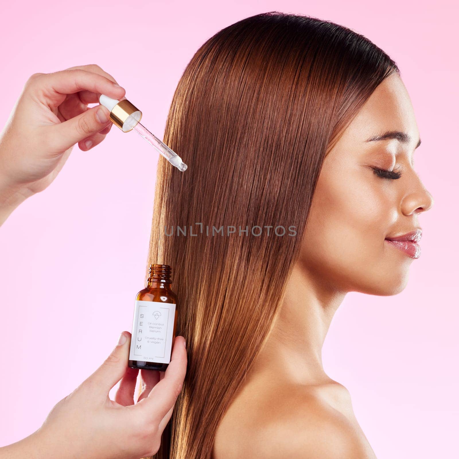 Woman, studio profile and hair care oil for shine, health and treatment for beauty, strong and wellness of scalp. Happy gen z model, serum and liquid formula for cosmetics, healthy locks and smile by YuriArcurs