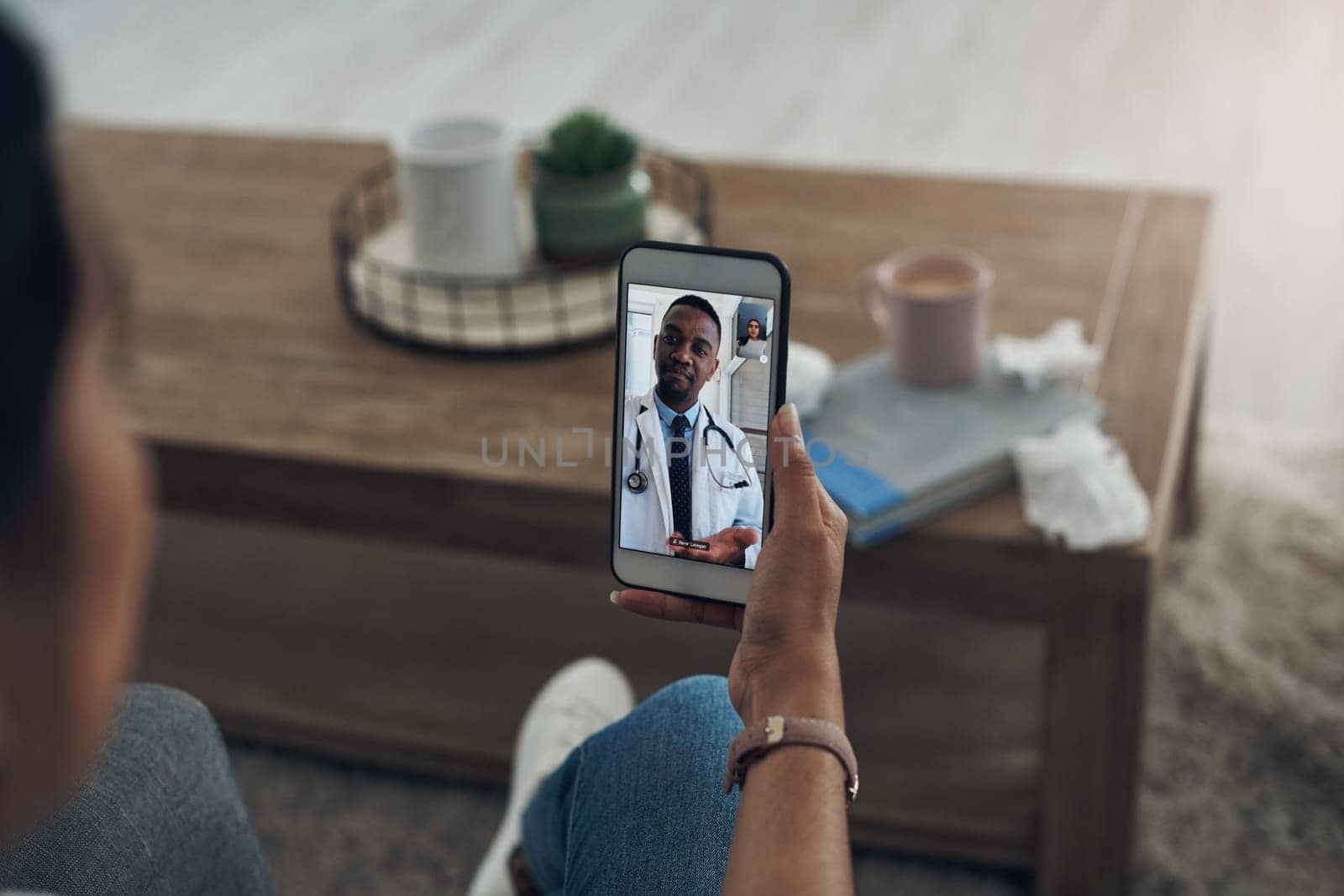 Phone, remote consulting with a doctor and a patient in the home for healthcare, medical or insurance. Video call, communication and contact with a person talking to a medicine professional online by YuriArcurs