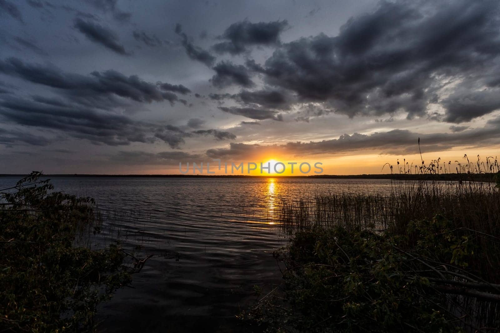 Incredibly beautiful sunset on the lake. High quality photo