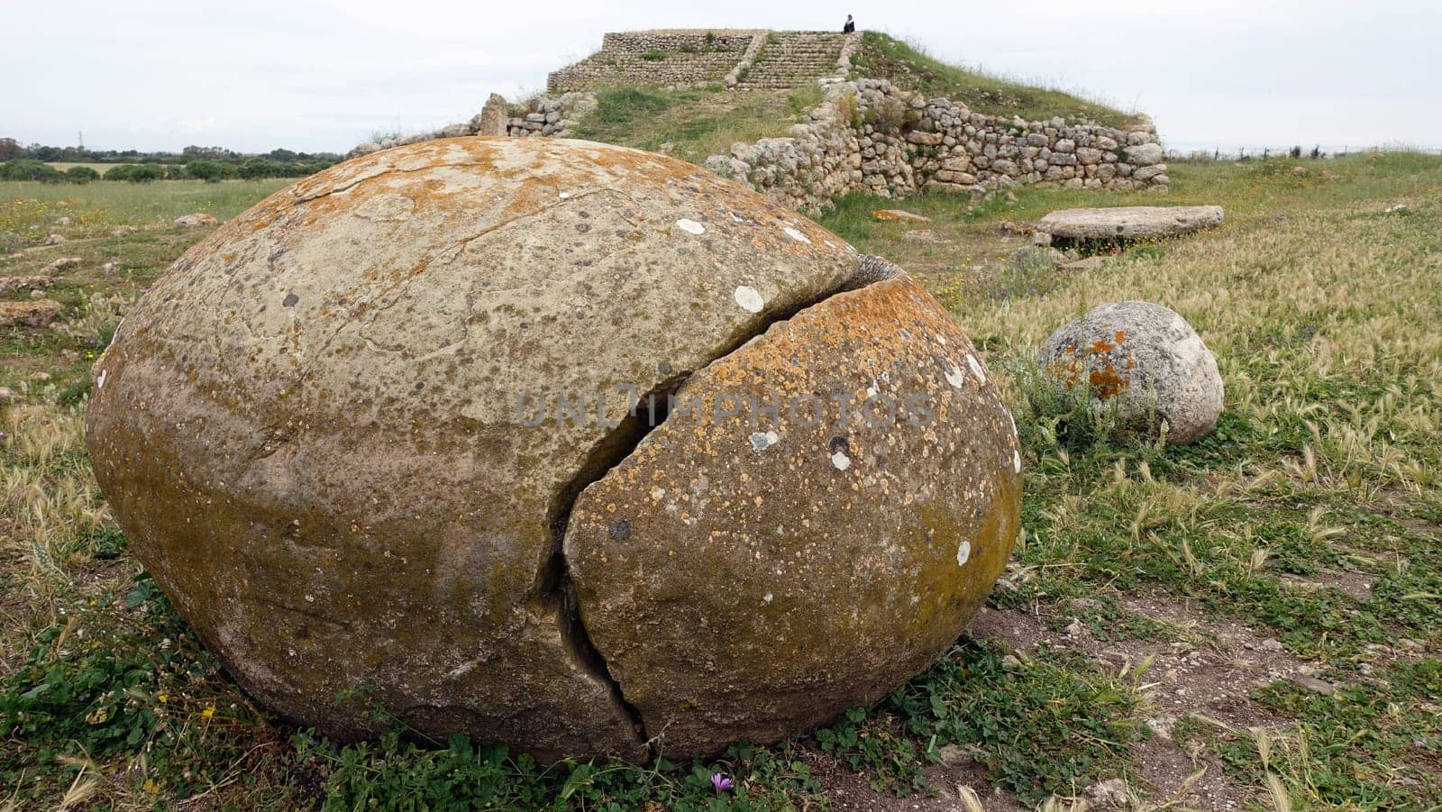 Sassari, Sardinia in Italy, May 18 2023. Some sacred stones in front of the sacred altar of Monte D'Accoddi. Dating back to 4000 BC.