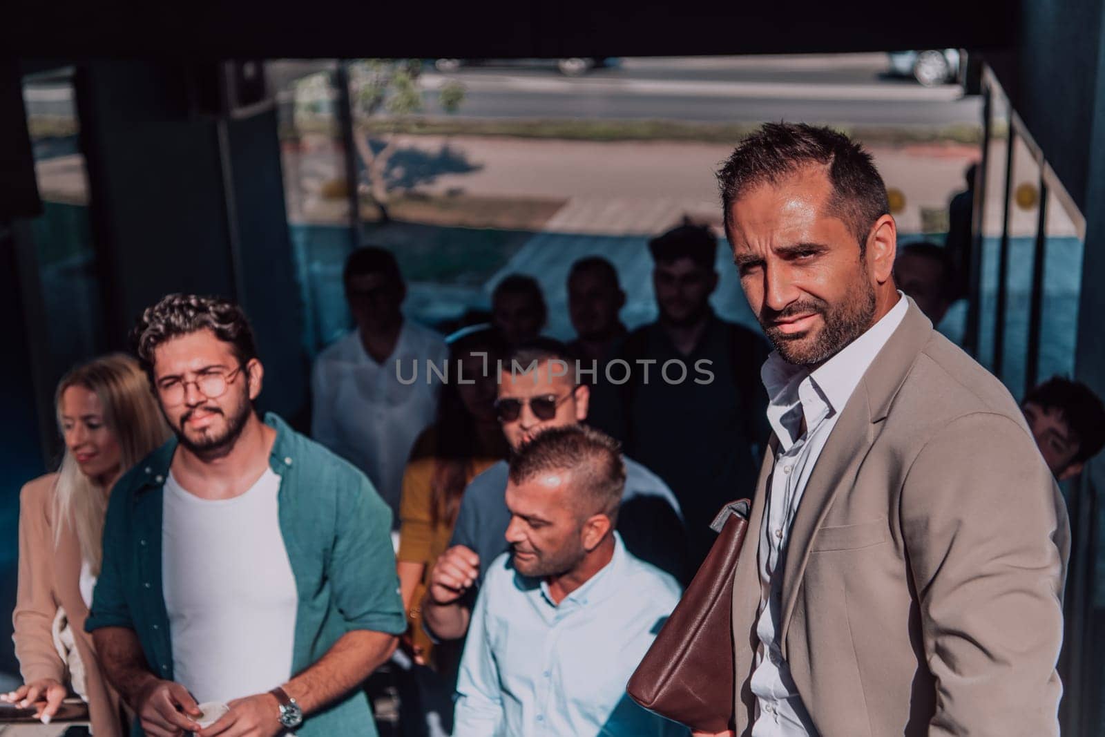 A diverse group of businessmen and colleagues walking together by their workplace, showcasing collaboration and teamwork in the company