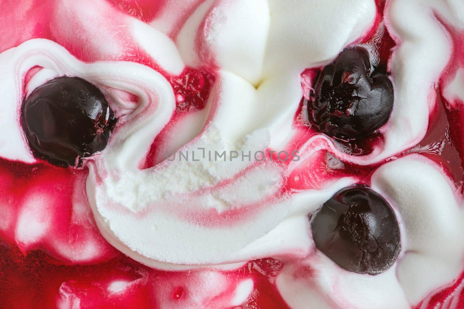 Texture of cherry ice cream. Fresh and delicious ice cream with cherries is a tasty treat for children and adults. by SERSOL