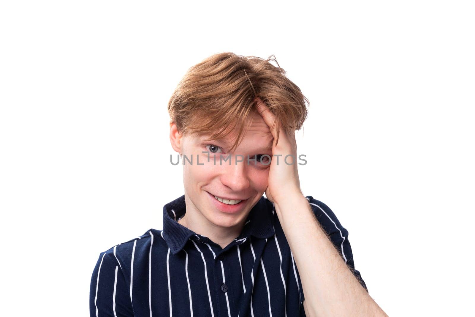 close-up portrait of a stylish handsome young blond man on a white background by TRMK