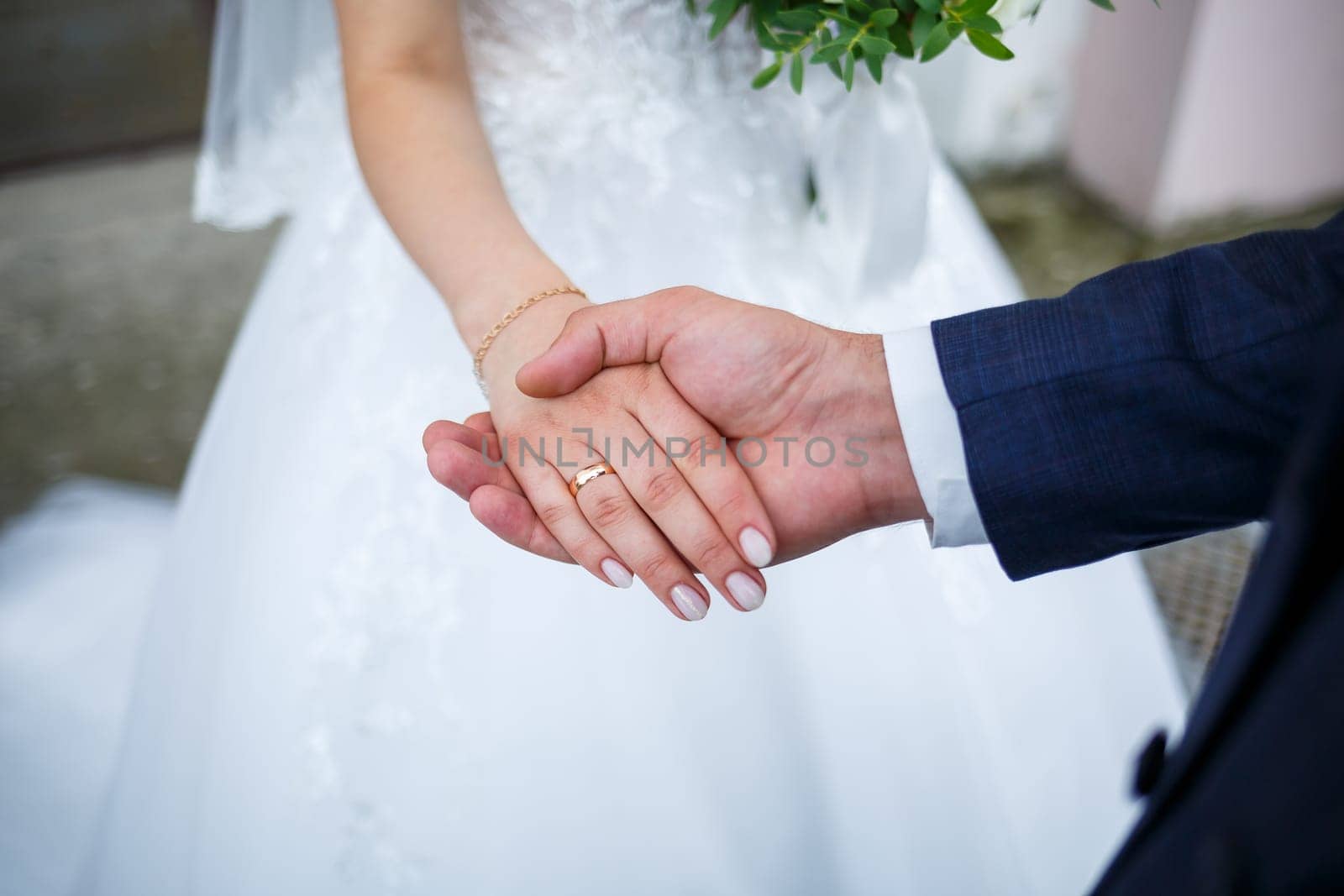 Newlyweds on wedding day, wedding couple holding hands, bride and groom